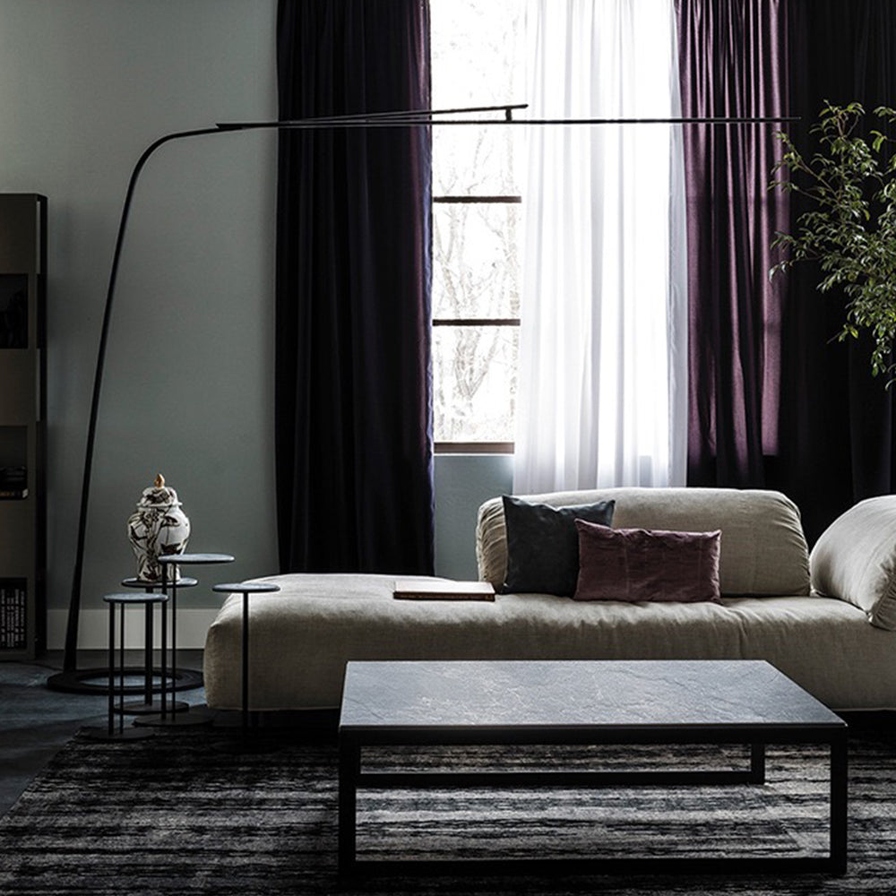 Modern black linear floor lamp in a minimalist living room