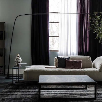 Modern black linear floor lamp in a minimalist living room