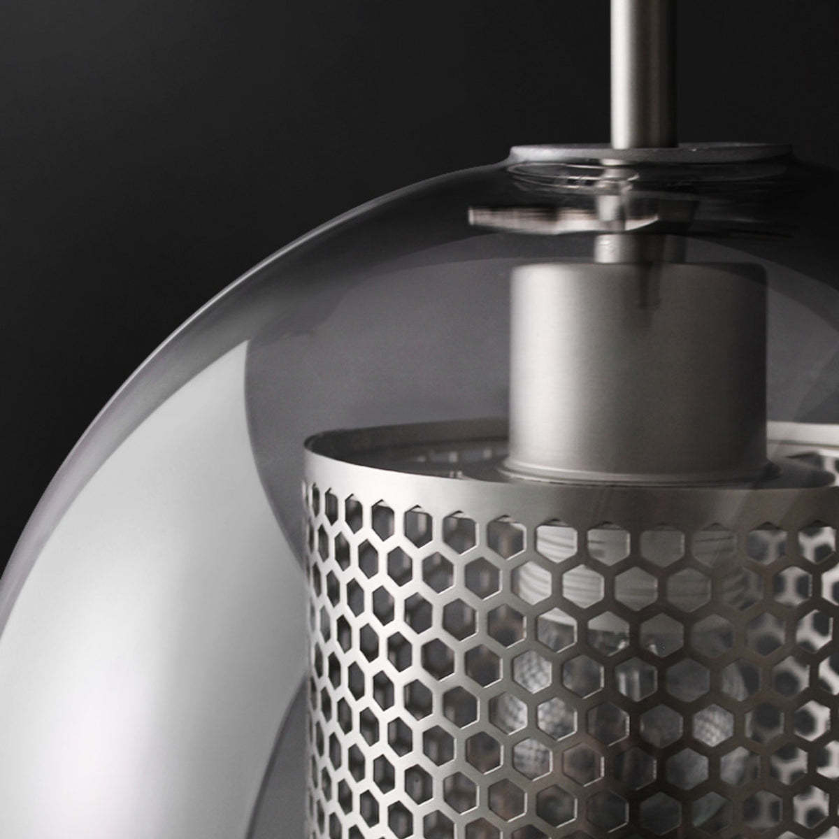 Modern metal pendant light detail, glass shade, hexagonal design