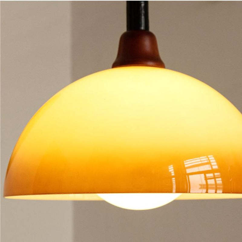 Hailie Retro pendant light amber glass shade close up