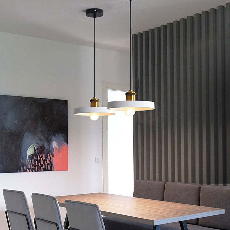 White Morandi pendant lights in a dining room