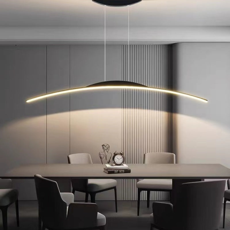 Modern linear pendant light over dining table
