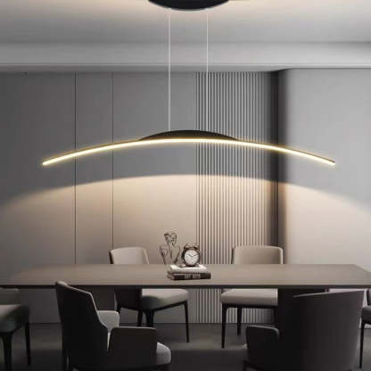Modern linear pendant light over dining table