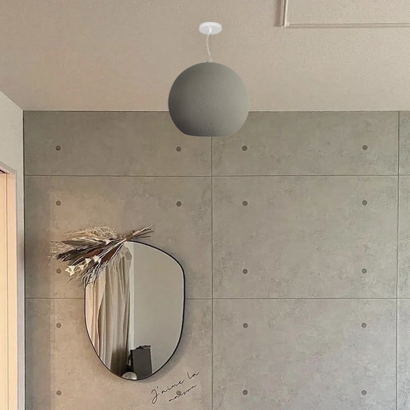 Byers pendant light in modern room with mirror.