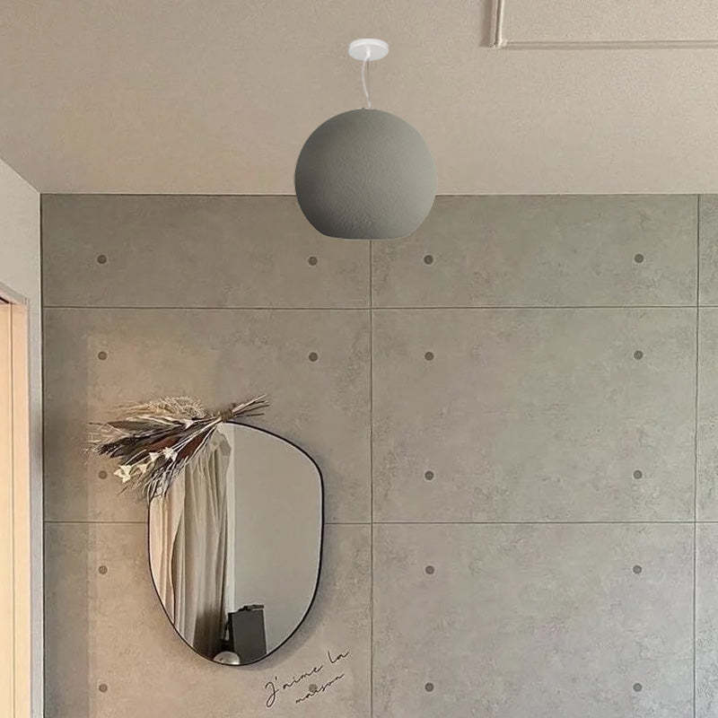 Byers pendant light in modern room with mirror.