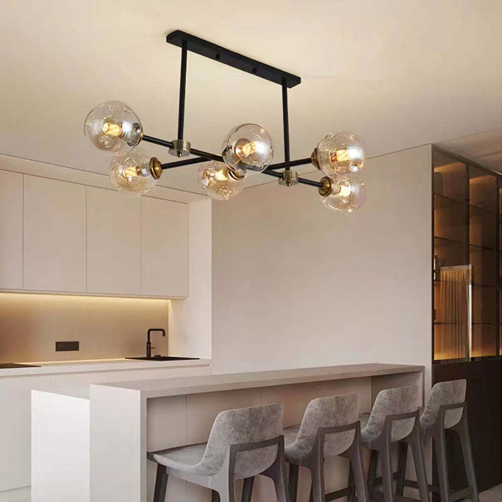 Glass bubble pendant light over kitchen island