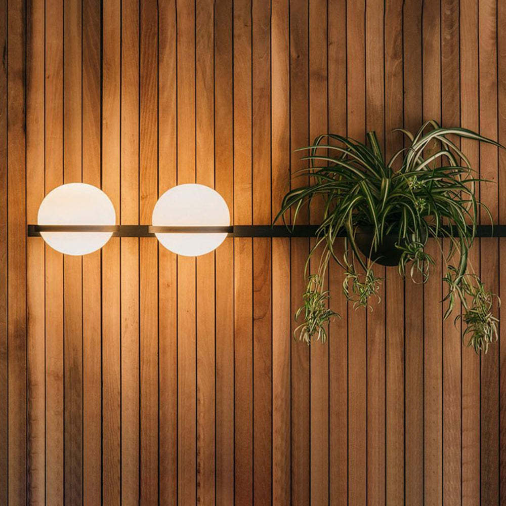 Modern outdoor wall lamp with plant, wooden wall