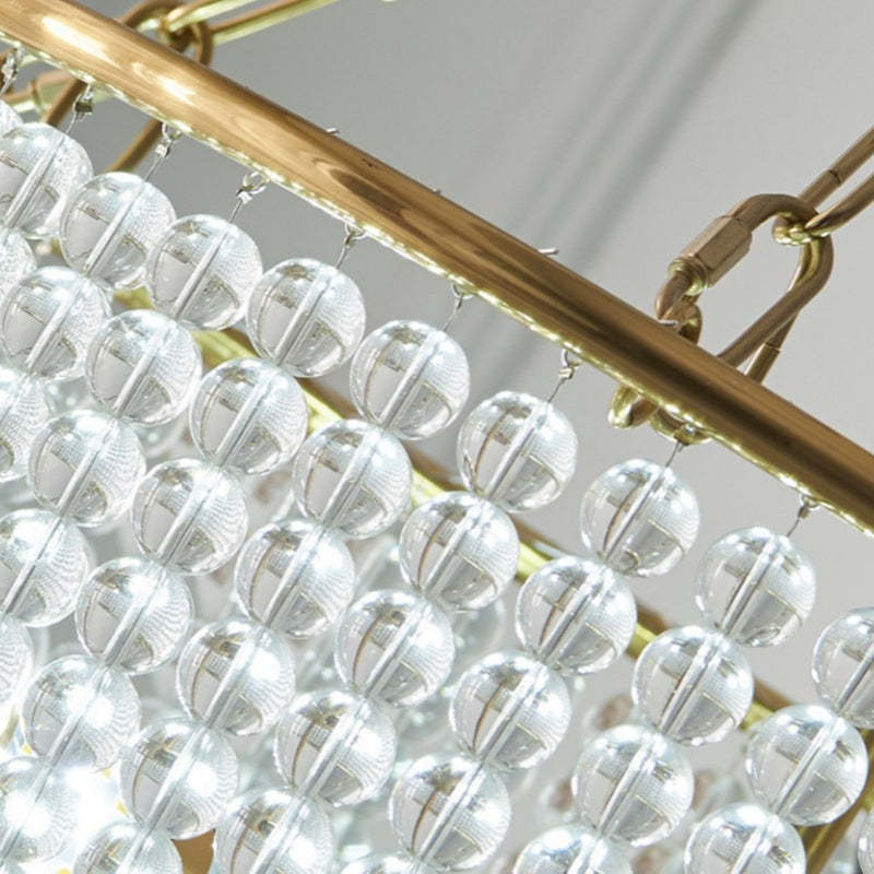 Alessio LED chandelier: Gold frame, crystal spheres detail.