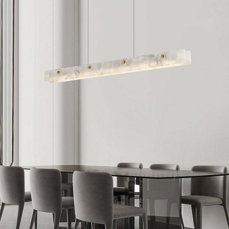Modern marble pendant light over dining table