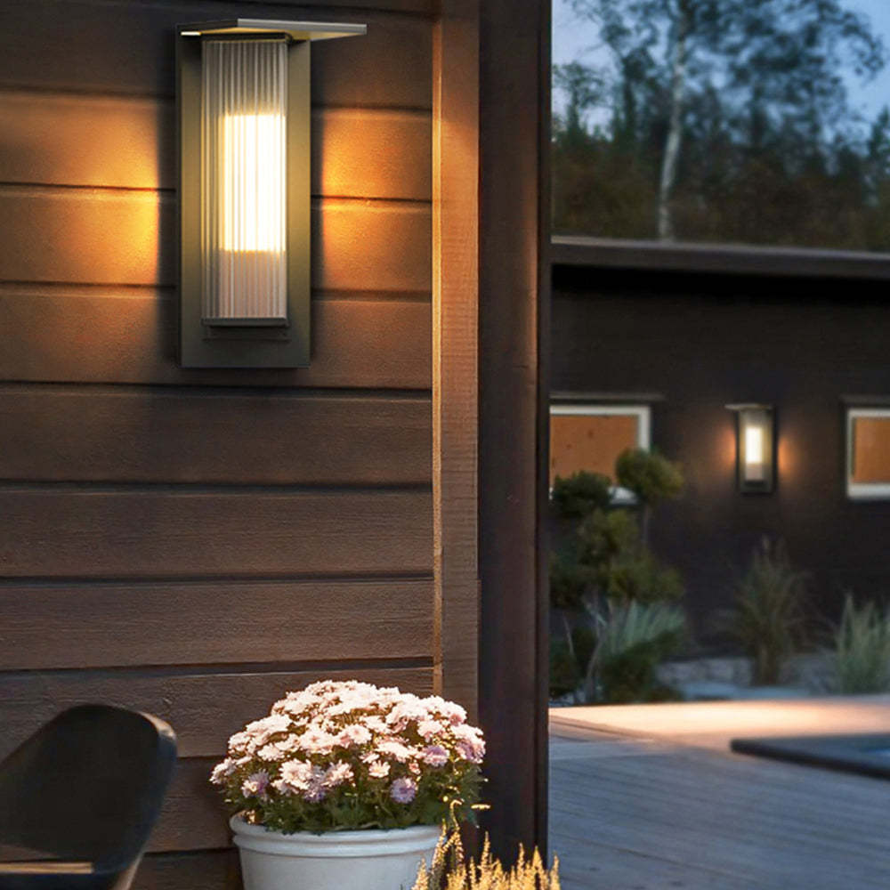 Orr Modern Outdoor Wall Lamp illuminating exterior, warm light.