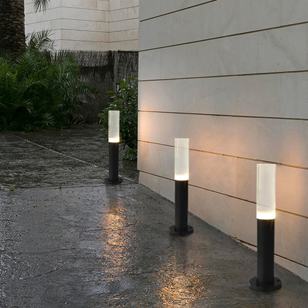 Modern outdoor path lights illuminating a walkway
