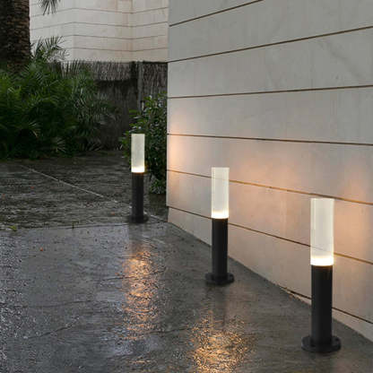 Modern outdoor path lights illuminating a walkway