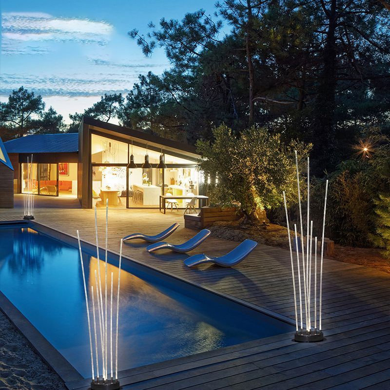 Riley Outdoor Ground Light illuminating a modern patio and pool
