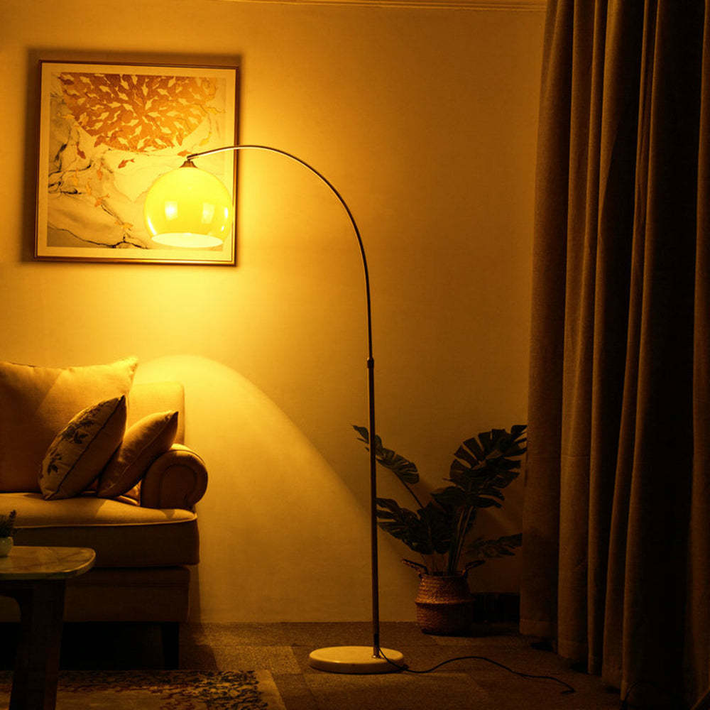 Salgado Floor Arc Lamp illuminating living room