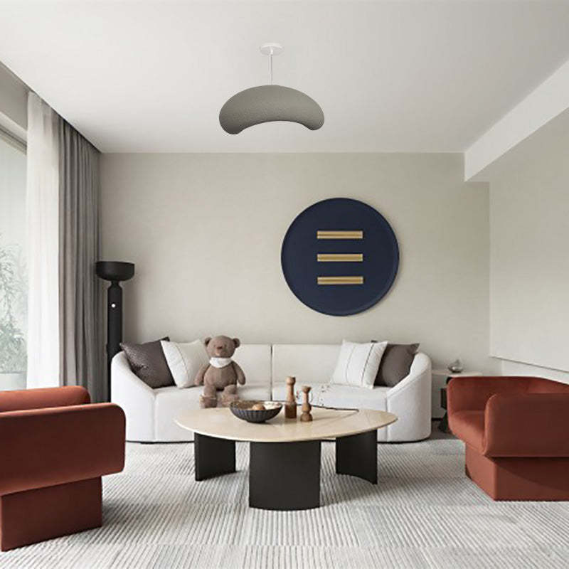 Cobblestone pendant light over modern living room setup.