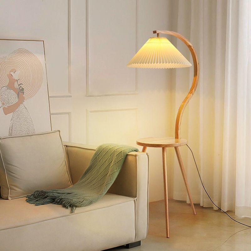 Modern pleated fabric floor lamp beside sofa