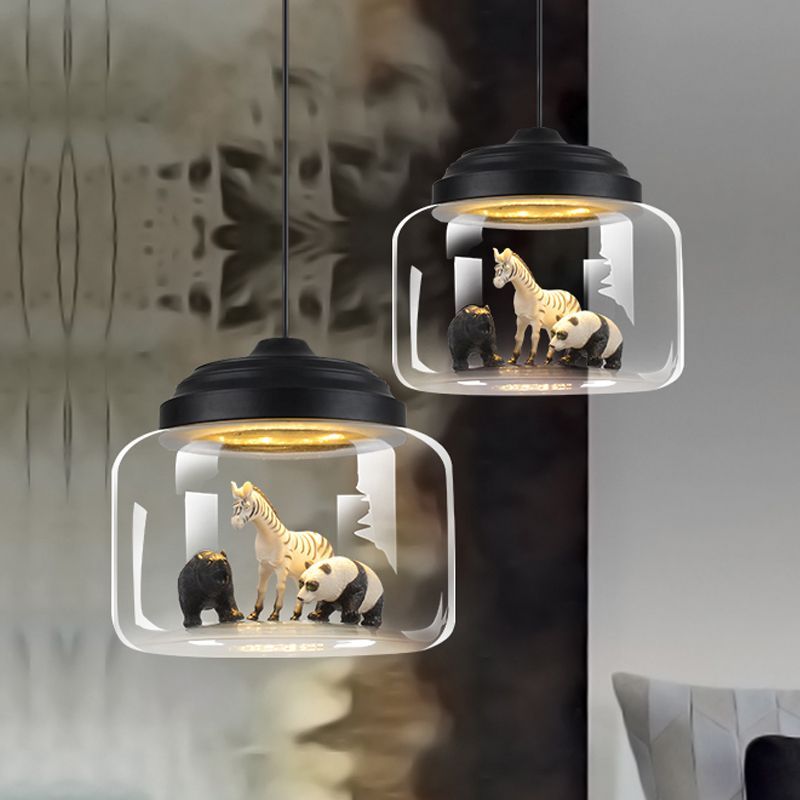 Leilani animal pendant light with zebra, panda, and bear figurines.