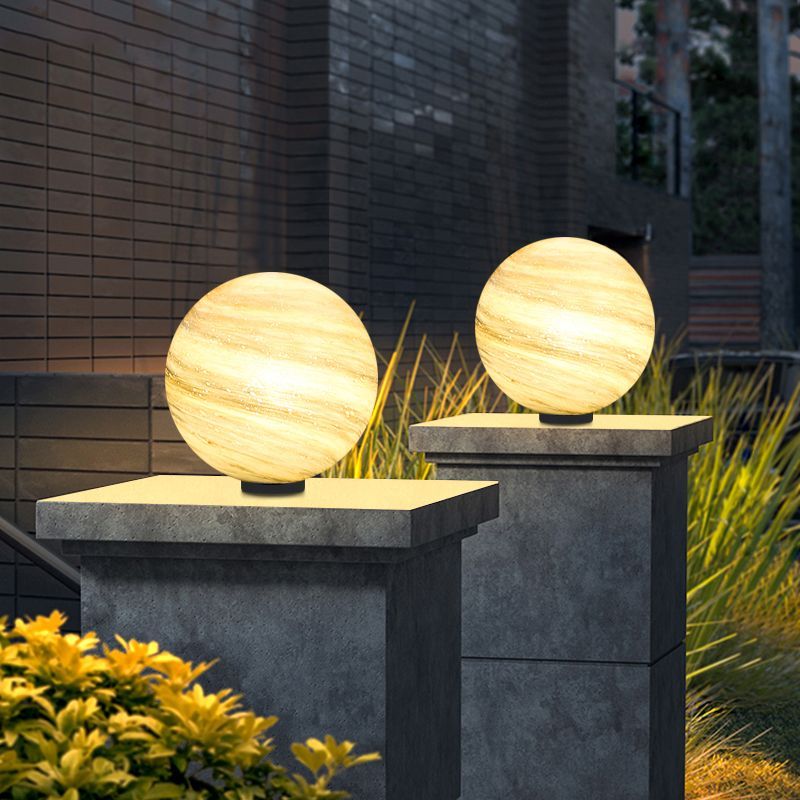 Elif Moon Globe Lights on stone pillars