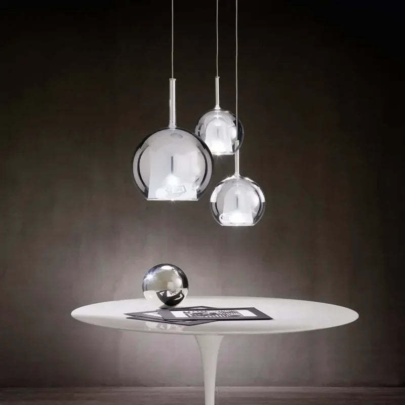 Modern sphere pendant lights Hailie collection on white table