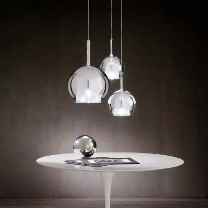 Modern sphere pendant lights Hailie collection on white table