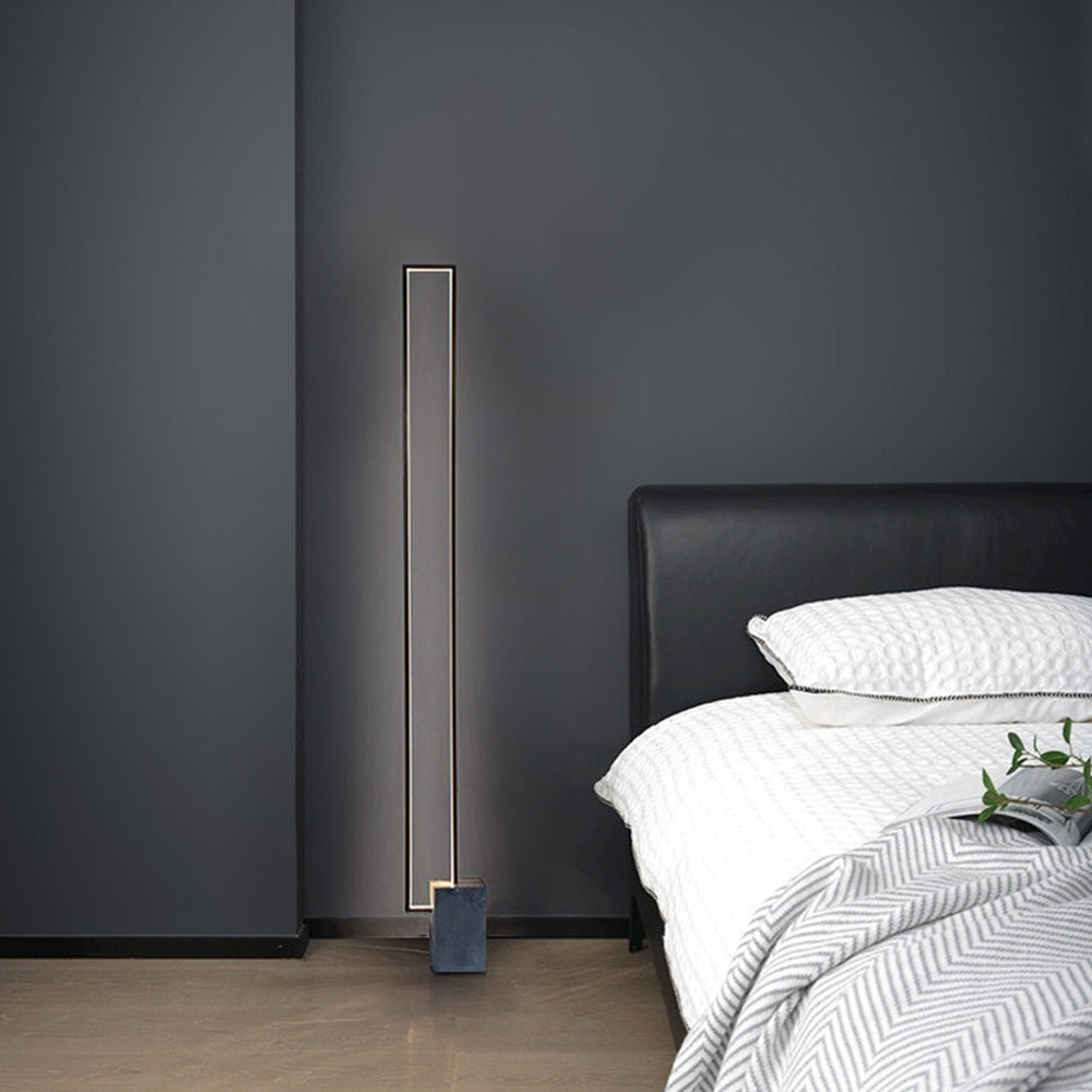 Modern minimalist floor lamp in bedroom setting