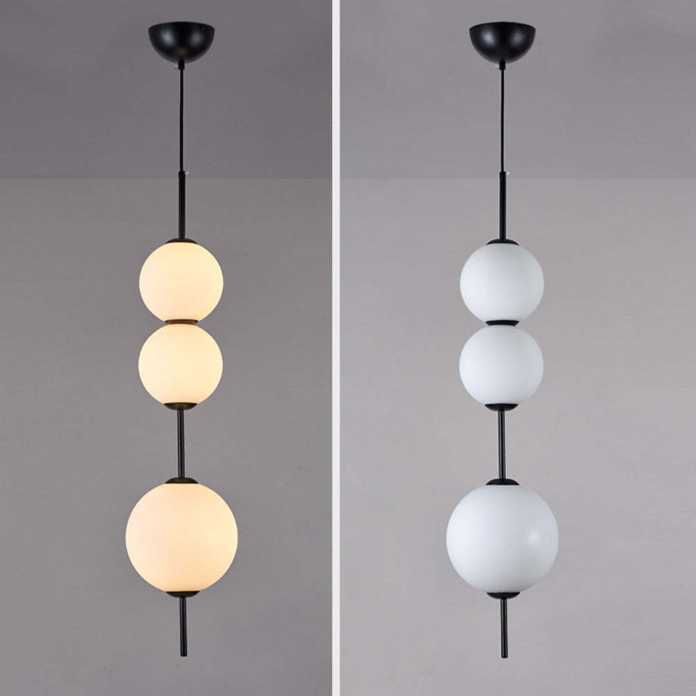 Valentina pendant light, three-ball design, black metal, glass shades, warm and cool light
