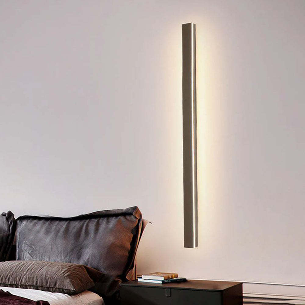 Modern minimalist wall light in bedroom setting