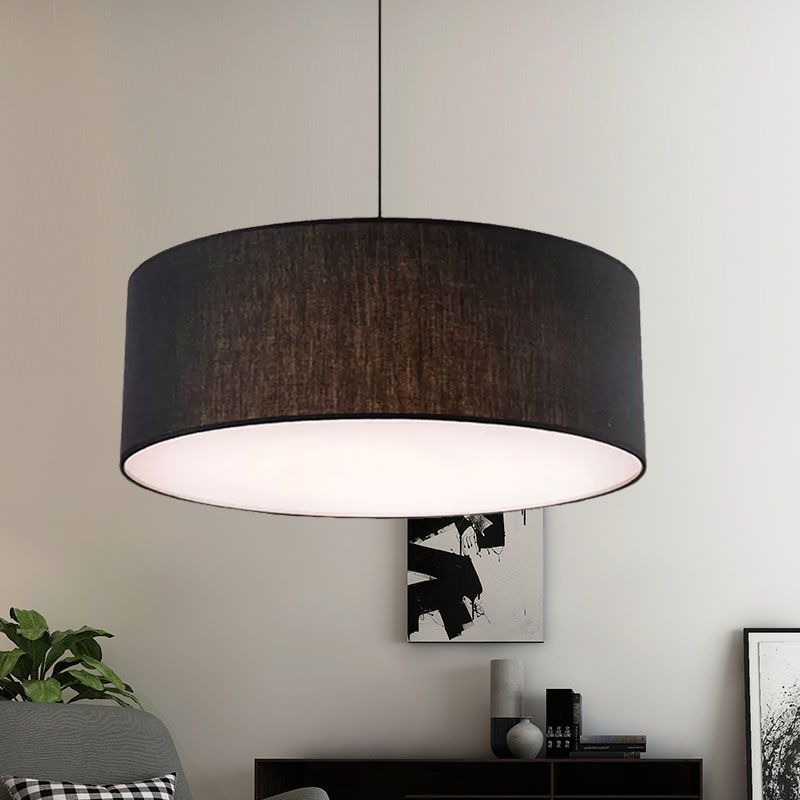 Renée black fabric drum pendant light in a living room setting