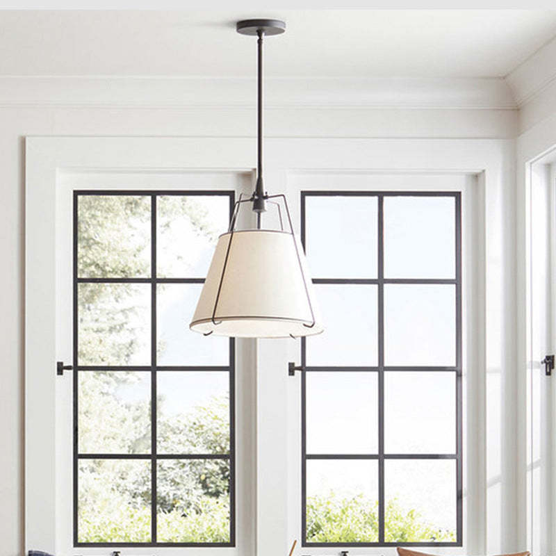 Conical fabric pendant light in dining room, Renée Modern