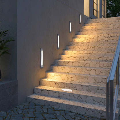 Modern LED step lights on stone stairs. Outdoor lighting.