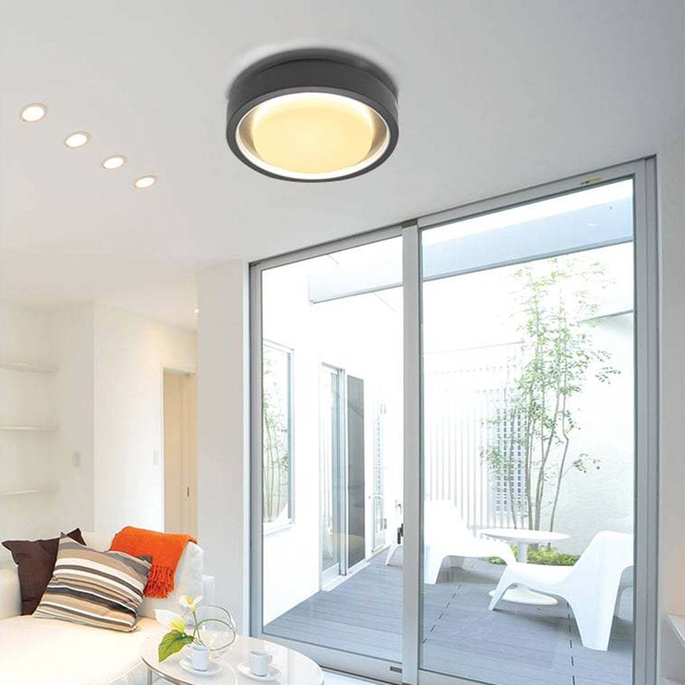 Orr Modern Circular Disc Wall Lamp illuminating living room
