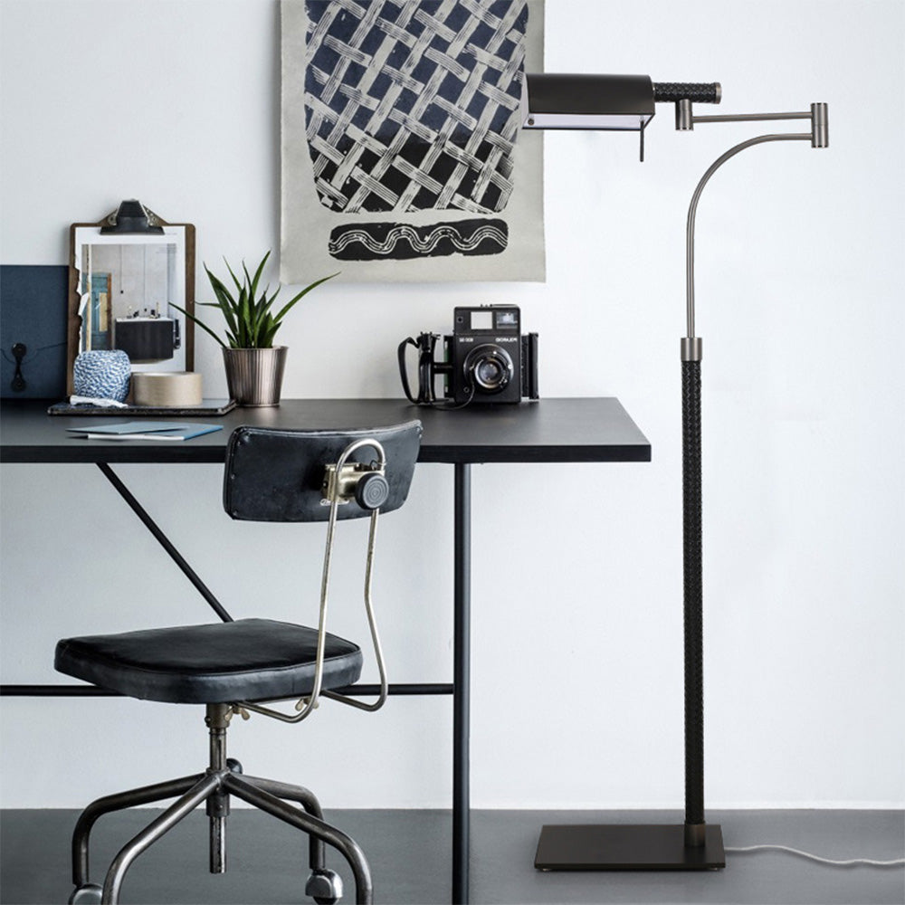 Salgado floor lamp next to a desk with decor