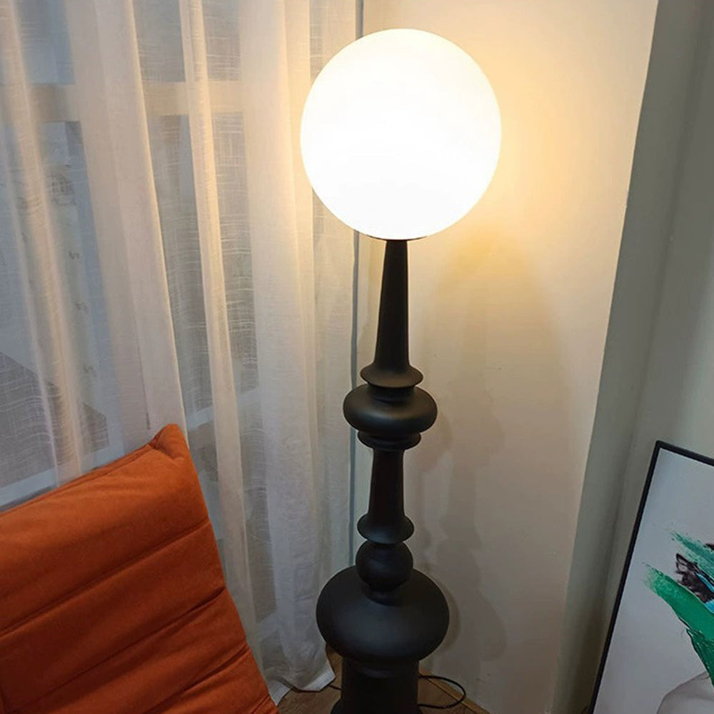 Salgado Retro Floor Lamp in bedroom with white curtain and orange pillow