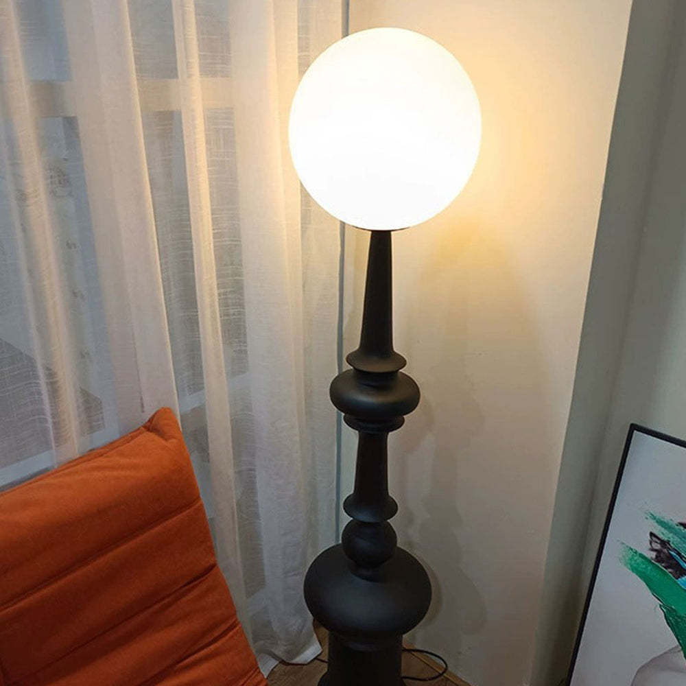 Salgado Retro Floor Lamp in bedroom with white curtain and orange pillow