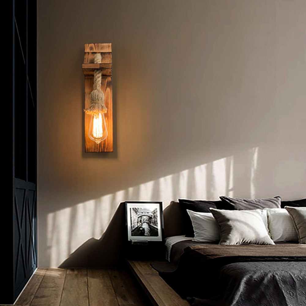 Rustic wood and hemp rope wall lamp in bedroom