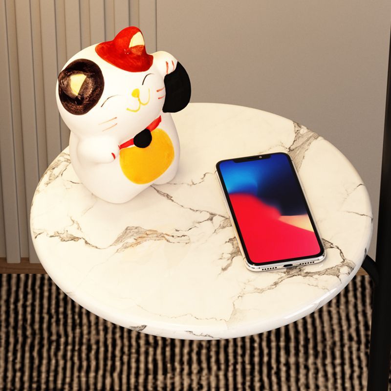 Ozawa floor lamp side table with lucky cat and phone.