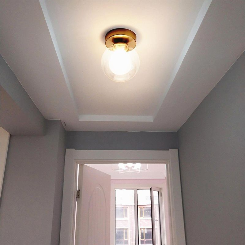 Modern Valentina globe ceiling light illuminating hallway