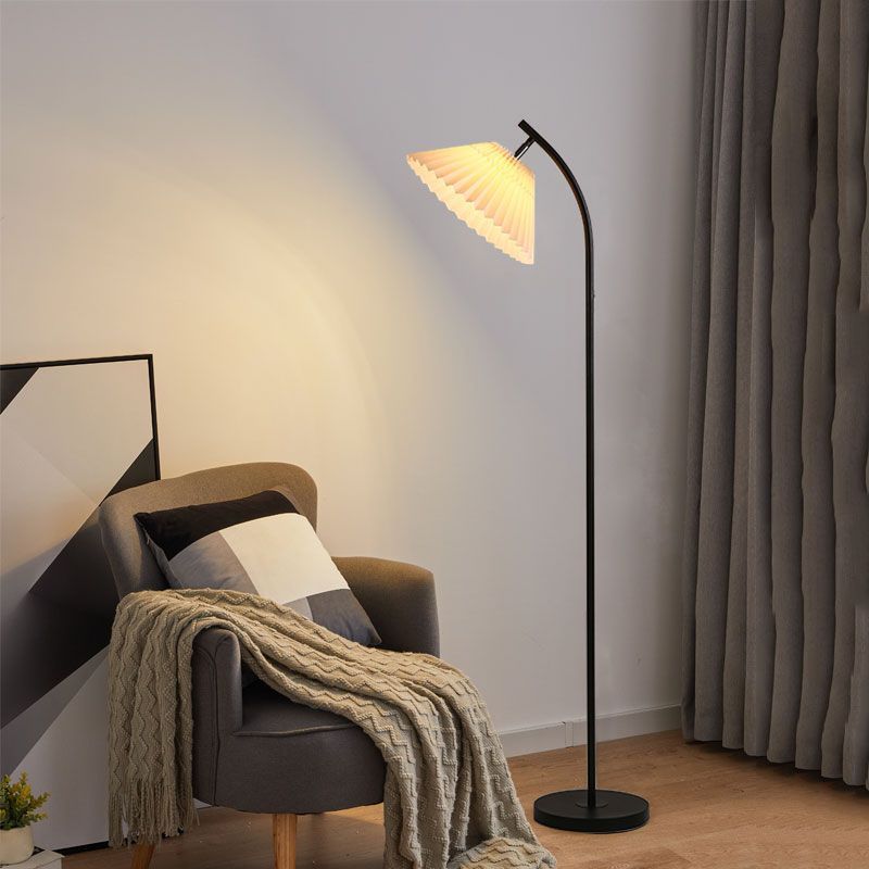 Ozawa Modern Arc Floor Lamp in a living room setting, pleated fabric shade