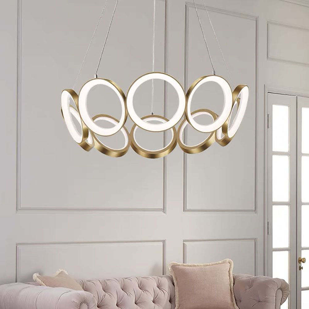 Arisha Ring Light - gold metal pendant over sofa