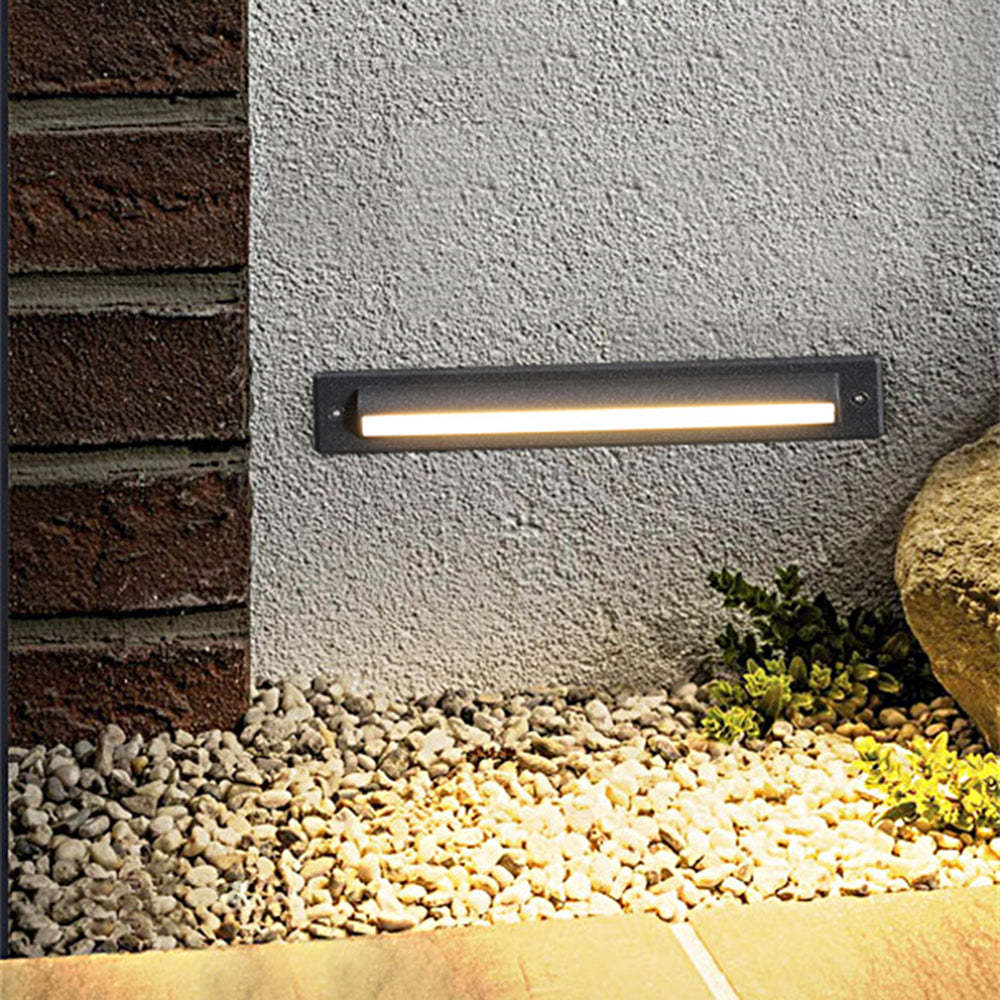 Outdoor step light illuminating garden, Orr style, warm light