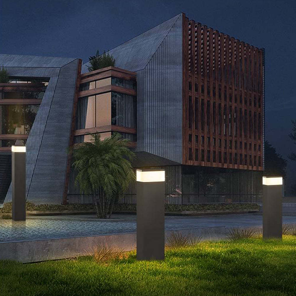 Outdoor path lights illuminating modern building exterior