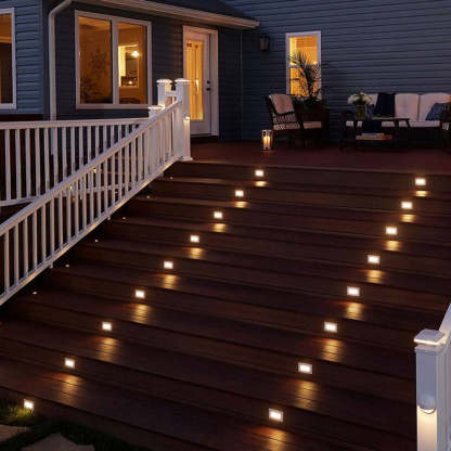 Outdoor deck lighting: Modern step lights on wooden stairs.