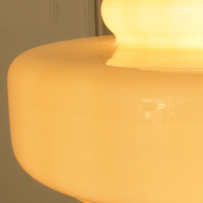 Morandi pendant light close-up, beige glass, warm lighting