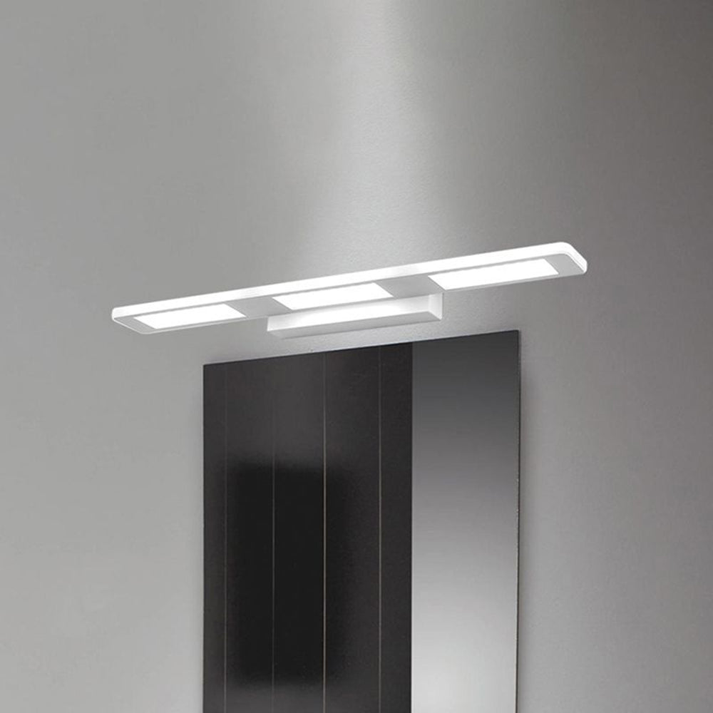 Modern Leigh wall lamp over bathroom mirror.