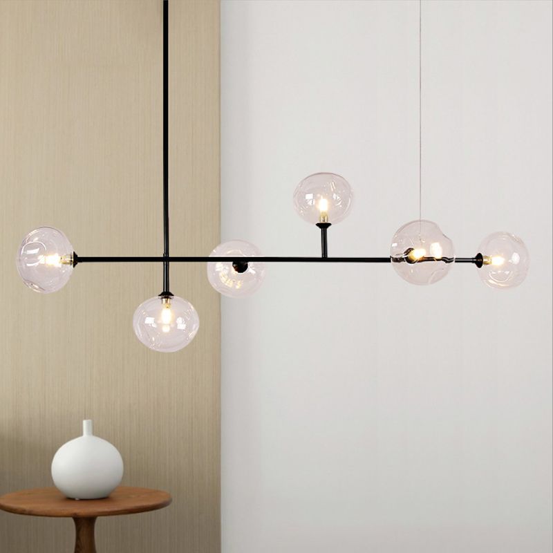 Modern black pendant light with clear glass spheres, home decor.