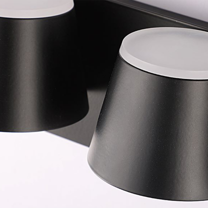 Close-up of Cooley Modern Wall Lamp's black shade