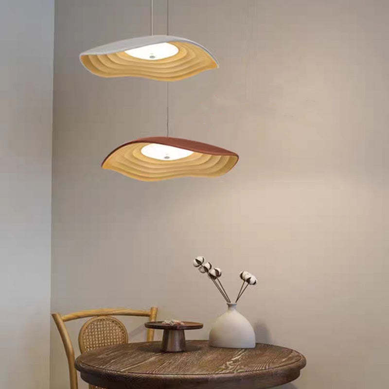 Resin LED pendant light over dining table