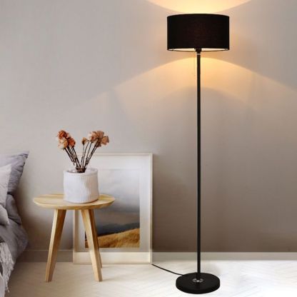 Eryn Black Cylinder Floor Lamp Near Bed