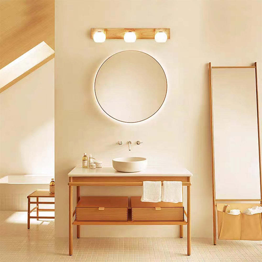 Bathroom interior with Lassola wall lamp and wooden vanity