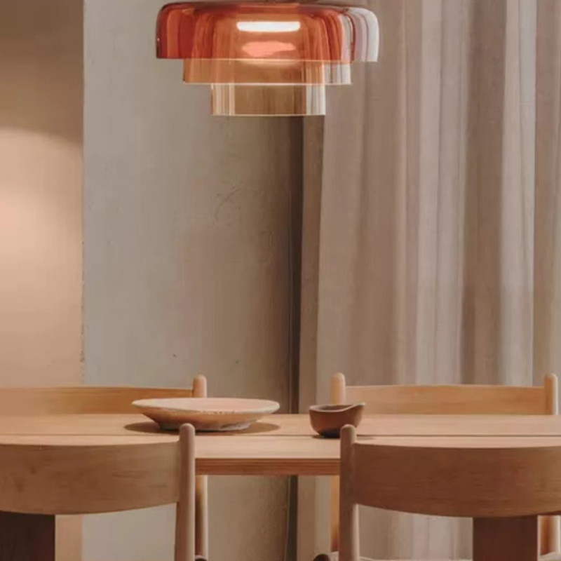 Orange Morandi pendant light illuminating dining room